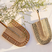 Decorative figure fan made of black natural fiber