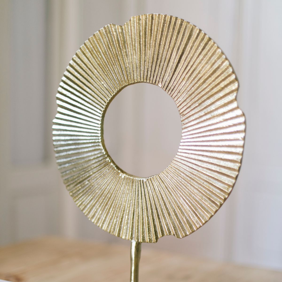 Abstract decorative figure made of golden metal