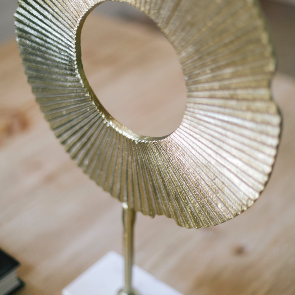 Abstract decorative figure made of golden metal