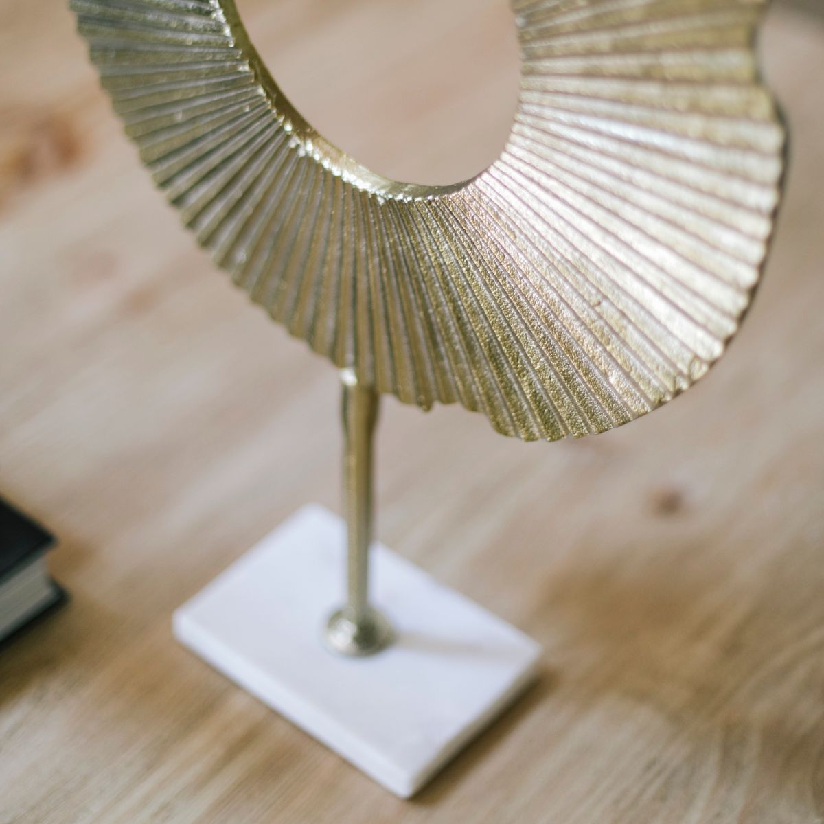 Abstract decorative figure made of golden metal
