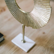 Abstract decorative figure made of golden metal