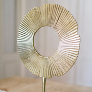 Abstract decorative figure made of golden metal