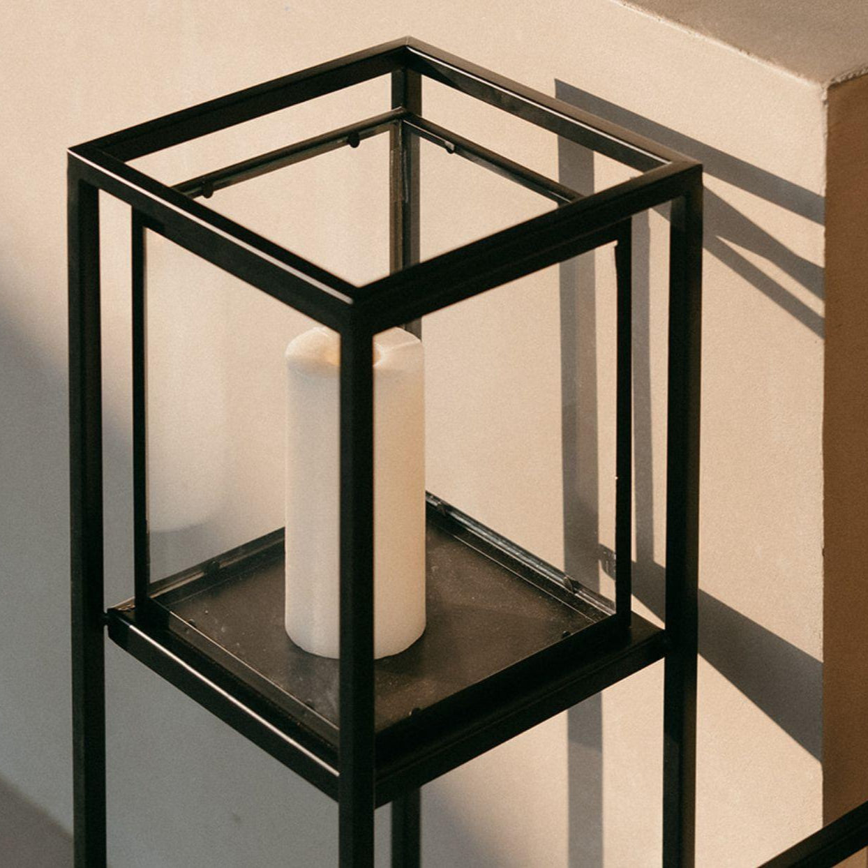 Industrial black metal and glass floor candle holder