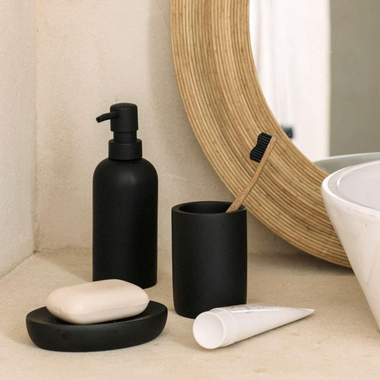 Black resin bathroom dispenser