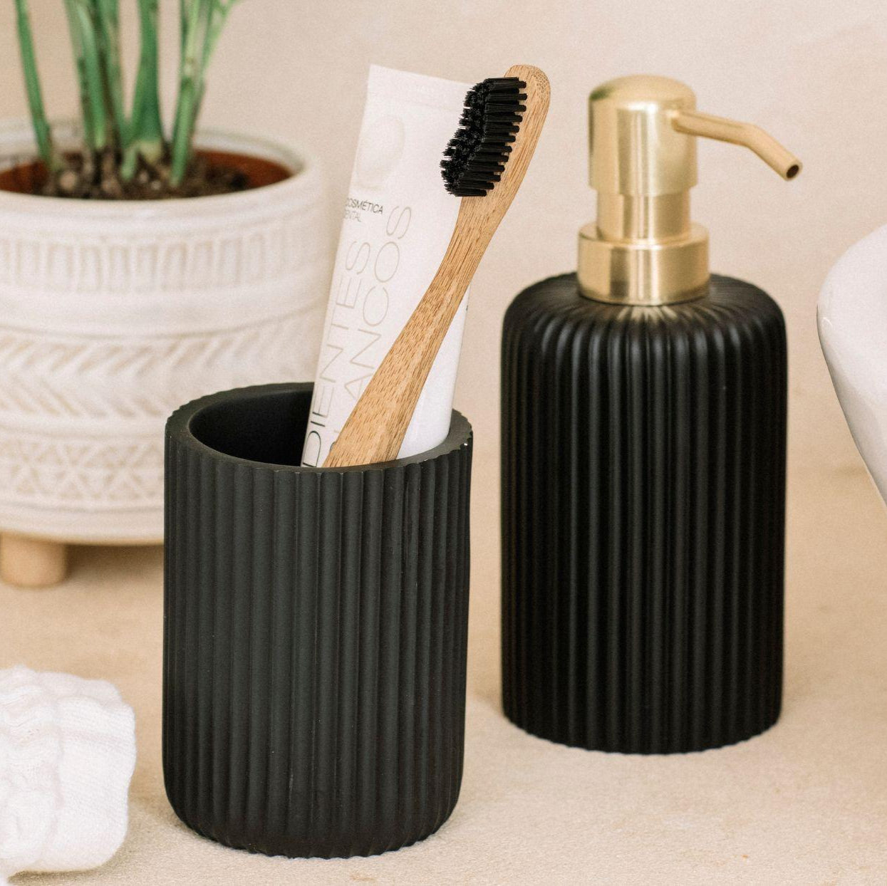 Black and gold resin dispenser