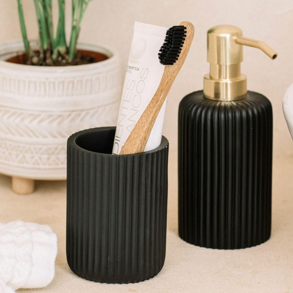 Black resin bathroom toothbrush holder