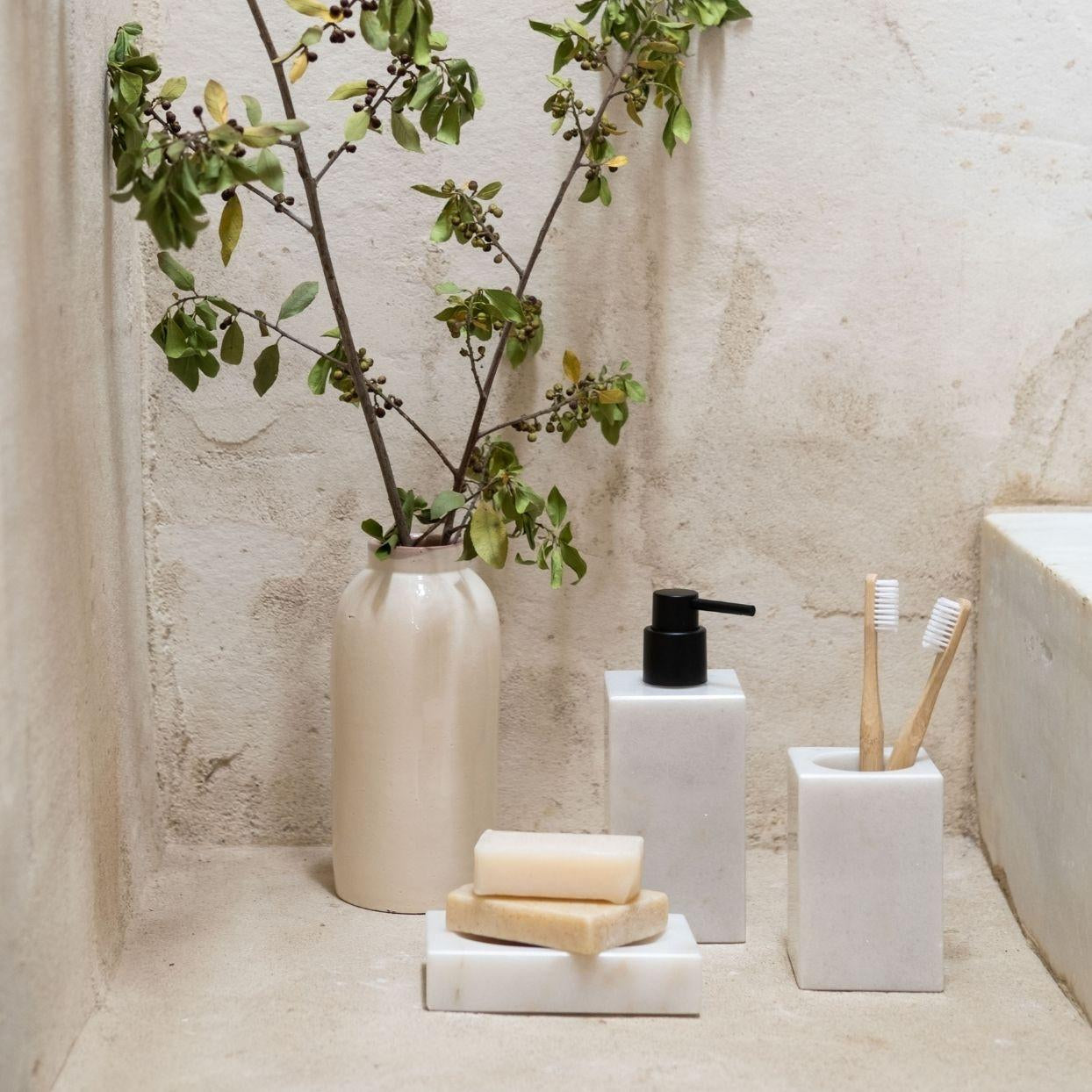 White marble bathroom dispenser