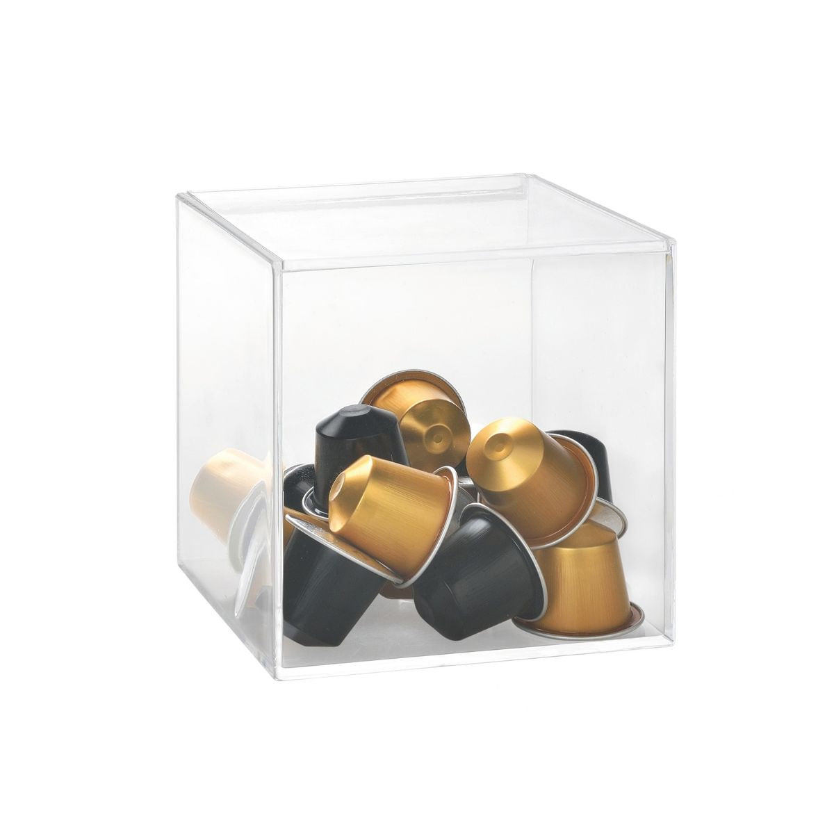 Caja transparente para almacenar cápsulas de café en colores dorado y negro.