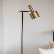 Gold metal industrial floor lamp