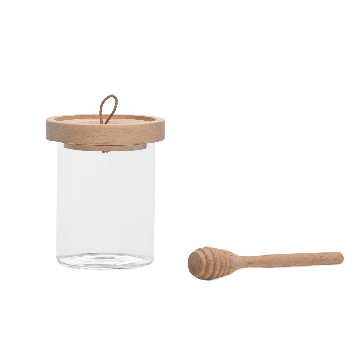 Tarro de miel de cristal con cuchara