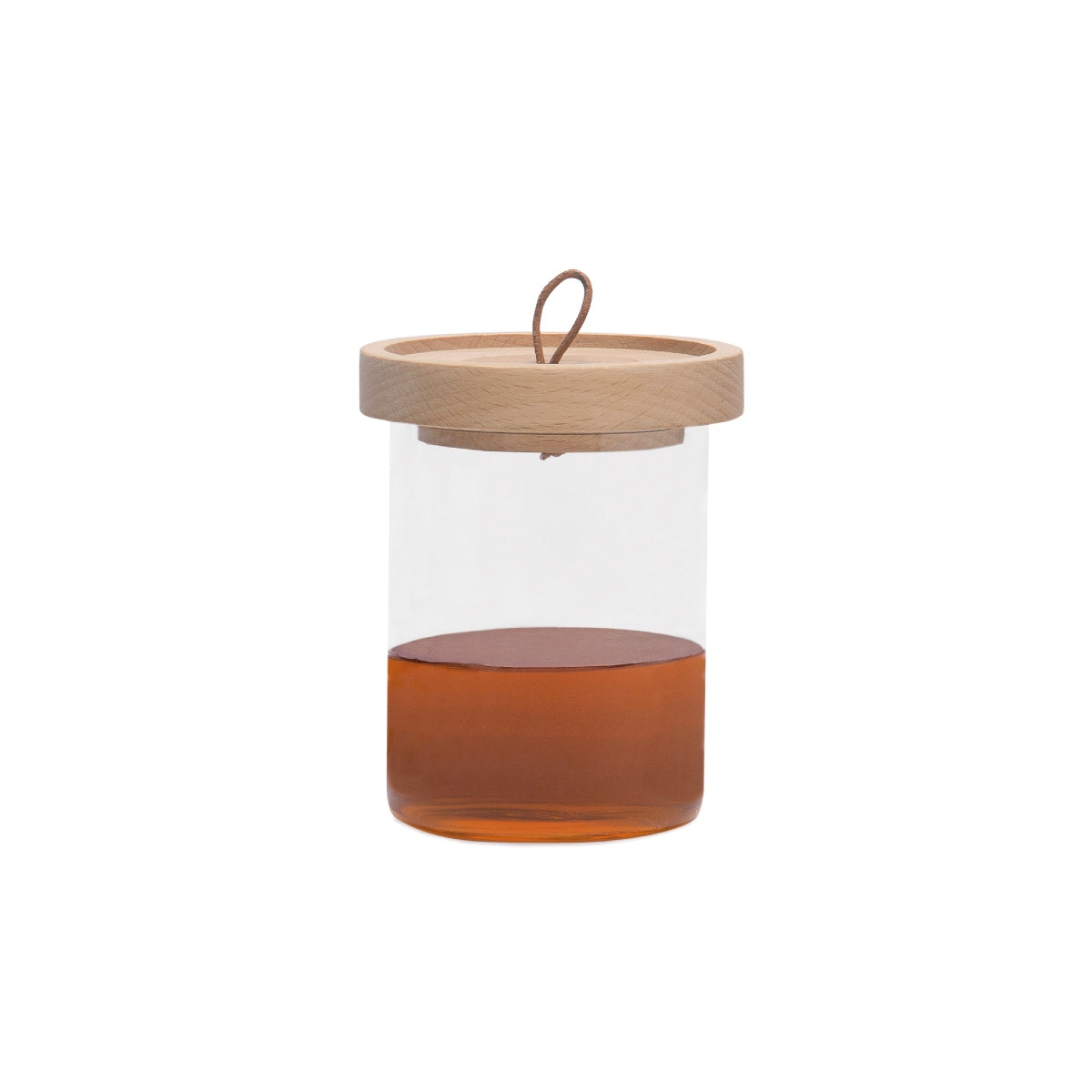 Tarro de miel de cristal con cuchara