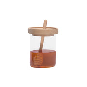 Tarro de miel de cristal con cuchara