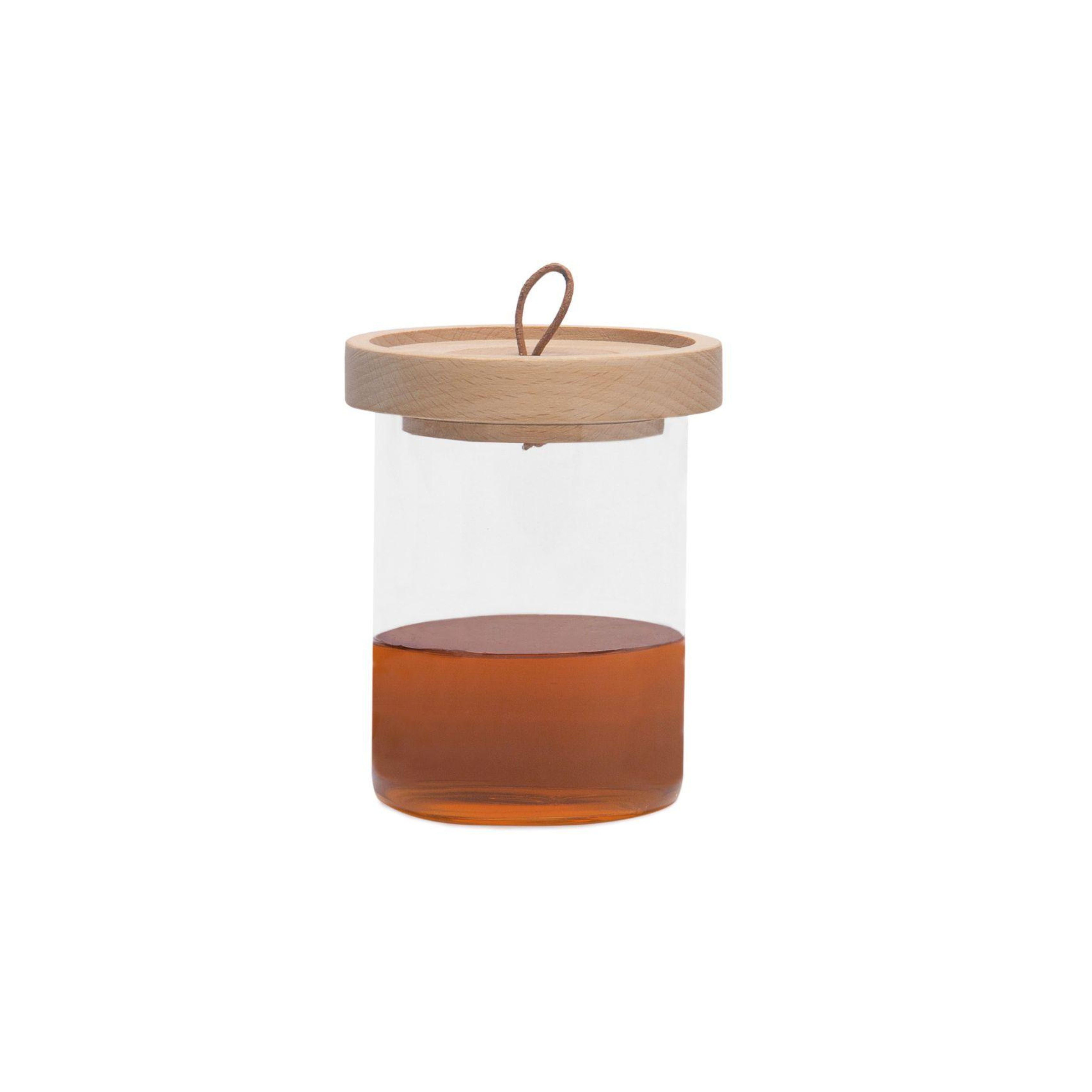 Tarro de miel de cristal con cuchara