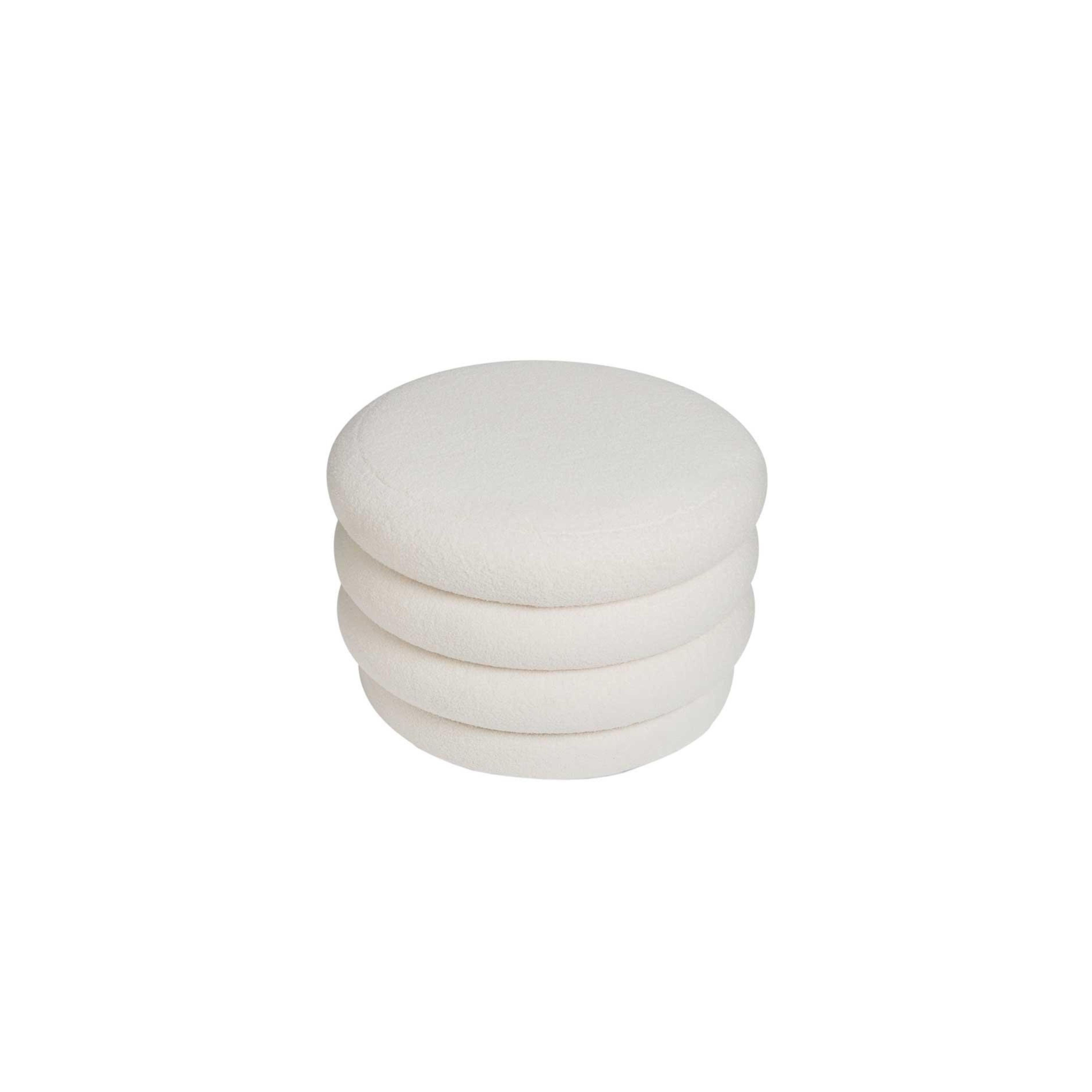 White upholstered storage pouf