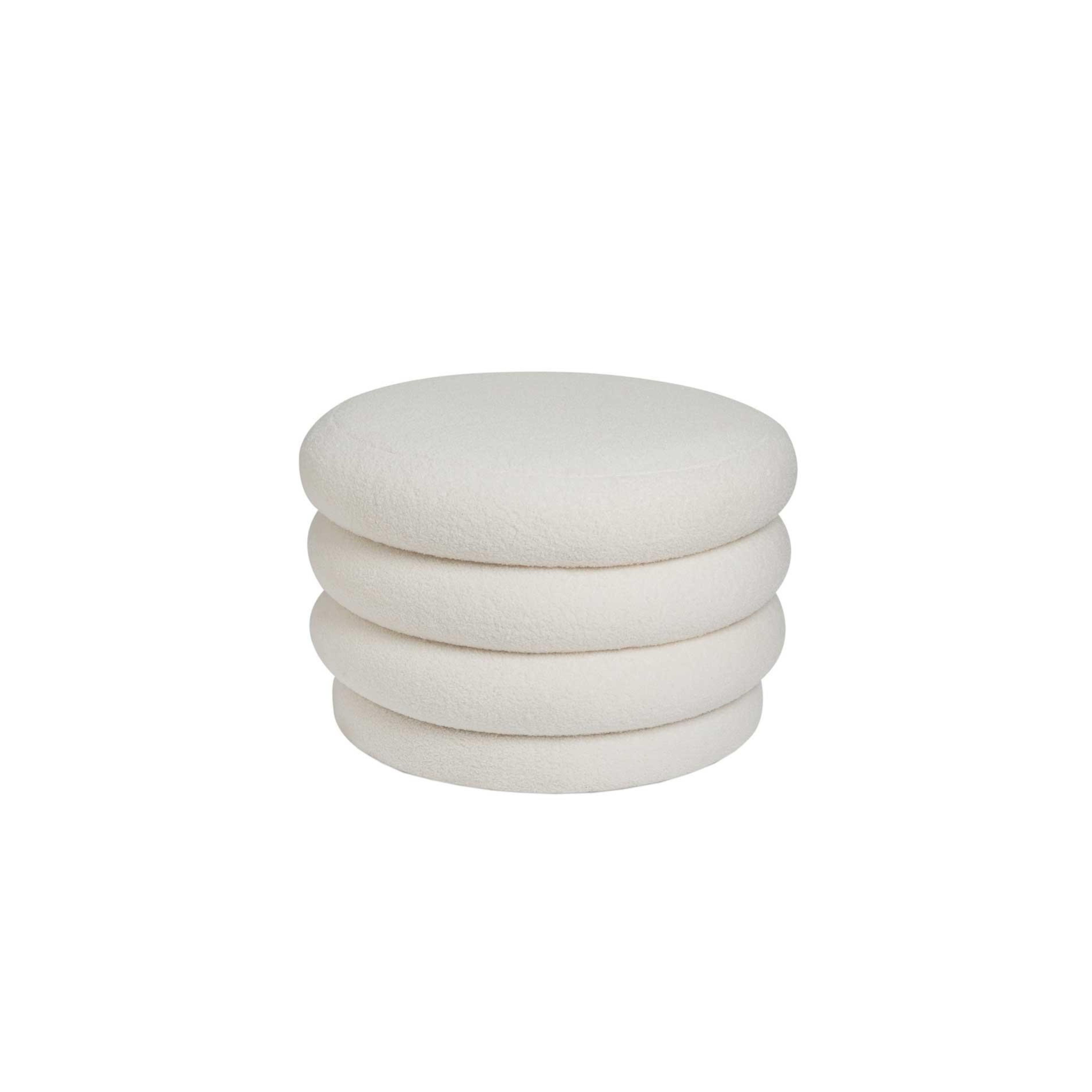 White upholstered storage pouf