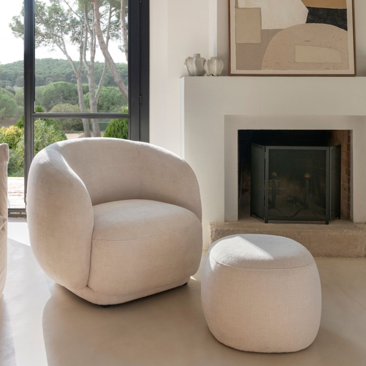 White upholstered round pouf