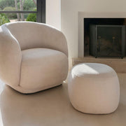 White upholstered round pouf